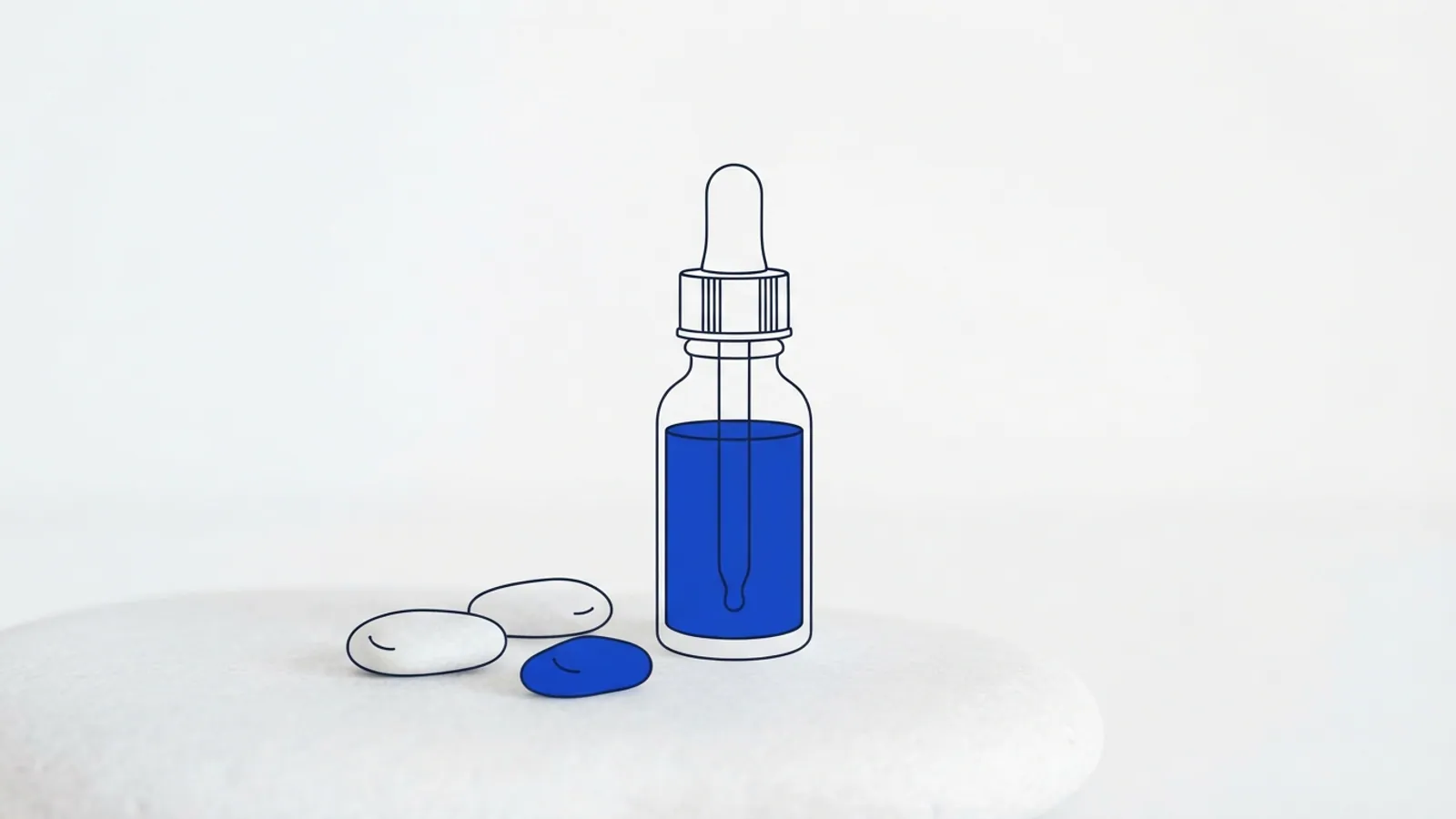 A plain serum bottle with a dropper on a stone surface surrounded by pebbles.